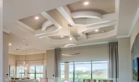 How can checking ceiling heights before designing false ceilings stop rooms from feeling low?