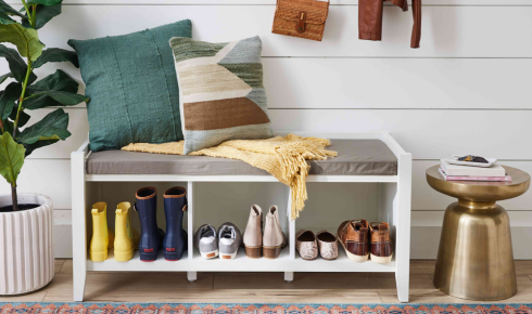 How can adding a small shoe rack with a closed front keep the entrance from looking messy?