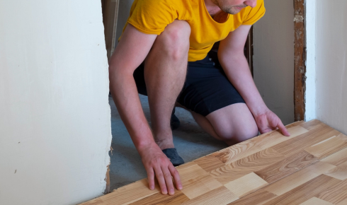 Why is it helpful to think about noise when selecting hard floors in flats with neighbours below?