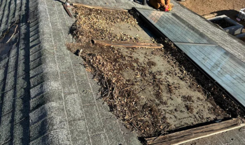 How can looking for old patchwork spots on the roof surface reveal repeated leakage issues?