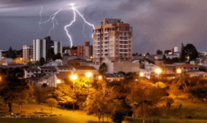 What benefit is there in checking if lightning arresters or grounding systems exist on tall buildings?