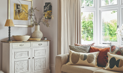 How can putting a lamp on a sideboard turn a dull corner into a cosy sitting spot?